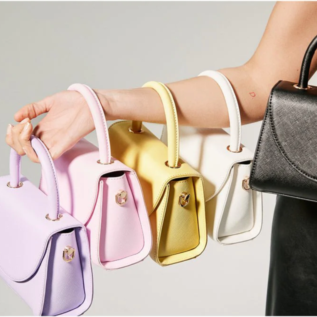 Bag top handle outlet